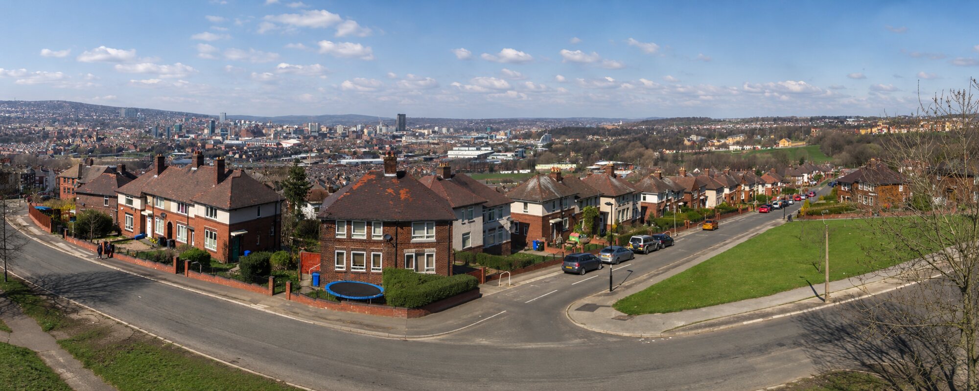 Panorama over Sheffield from the elevated site at Myrtle Road, Heeley — the city skyline to the left, green hills to the right